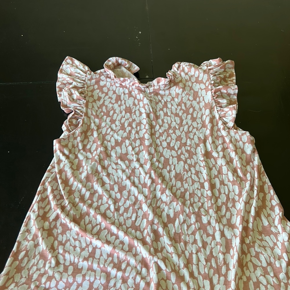 Pink and white business casual top.